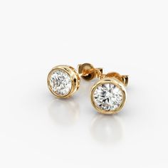 14K Yellow Gold Bezel Diamond Stud Earrings (1.00 CTW - H-I / SI1-SI2). This hand crafted, bold design accents the beauty of the round brilliant diamonds by using a thin bezel and circle accented basket. These earrings will fit snugly against the ear and features friction backs. Bezel Diamond Earrings, Diamond Earing Designs Unique, Everyday Earrings Simple, Gold Earrings Models, Diamond Videos, Gold Jewellery Design Necklaces, Beaded Collar, Notes Template, Diamond Stud Earrings