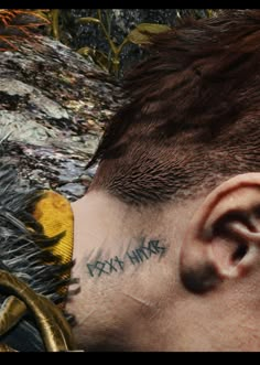 a close up of a person with tattoos on his face and neck, next to a dragon