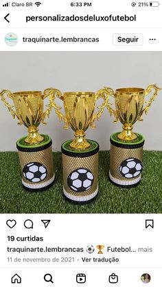 three soccer trophies sitting on top of a grass covered field with the words, personalizando