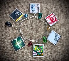 a bracelet with pictures and charms on it