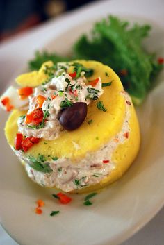 an appetizer is displayed on a plate with lettuce