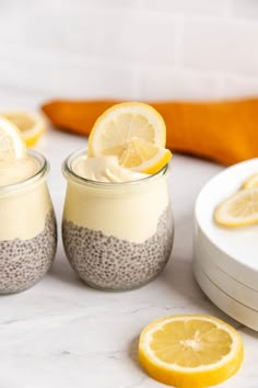 two jars filled with chia pudding topped with lemon slices