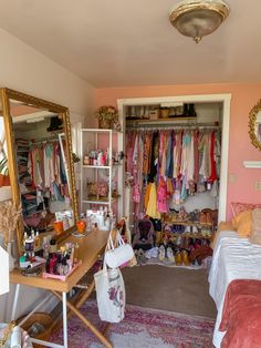 a bedroom with pink walls and lots of closet space