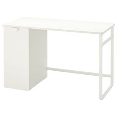 a white desk sitting on top of a white floor