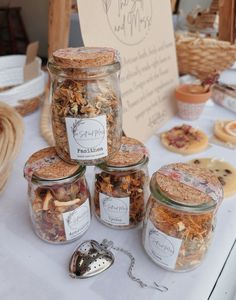 several jars filled with food sitting on top of a table