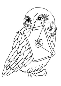 an owl is holding a letter in its beak and has it's eyes open