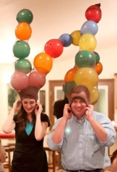 two people with balloons on their heads