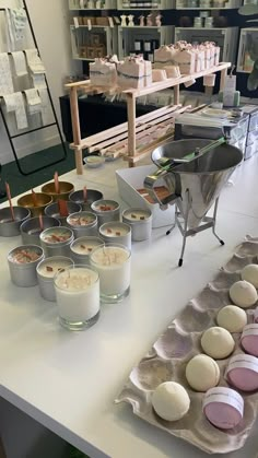 some cupcakes are sitting on trays next to each other in the kitchen