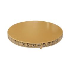 a gold plate with intricate designs on the edges and sides, set against a white background