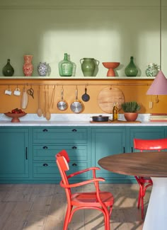 an image of a kitchen setting with pots and pans on the wall