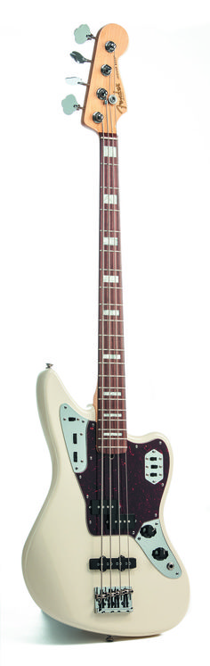 an electric bass guitar sitting on top of a white surface with its neck cut out