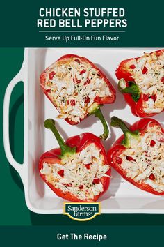 chicken stuffed red bell peppers served in a white serving dish