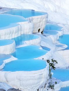 there are many blue pools in the snow