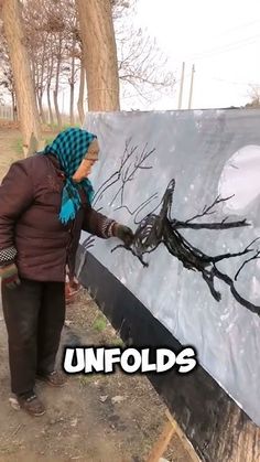 a woman is painting on an easel in front of trees and the words unfolds