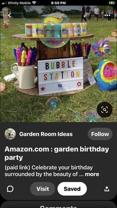 an advertisement for bubble station with balloons and streamers in the grass, next to a sign that says bubble station