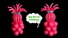 two pink balloons are sitting next to each other with the words ask me for a balloon above them