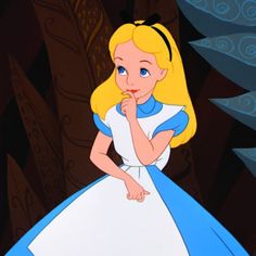 alice in the woods looking at something with her hand on her chin and finger to her mouth