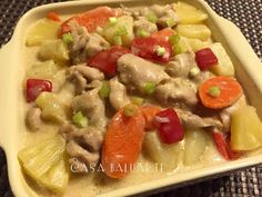 a yellow plate topped with meat and veggies