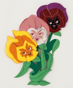 an image of three flowers with faces on them