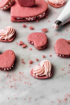 some heart shaped cookies are on a table