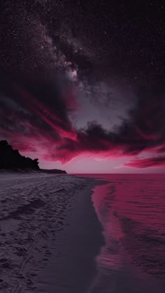 the sky is filled with pink and purple clouds as the sun sets on the beach