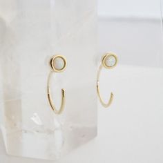 "Threader hoop earrings dotted with a tiny opal. Wear these beauties solo or alongside your favorite studs or hoops. 1/2\" tall. Our materials make for an amazing, high quality, seamless, jewelry piece with longevity. Our earrings are plated with 18k gold, 18k rose gold, or rhodium and finished with a protective coating. A little secret we'll keep between us: it looks way more than it costs." Kelsey Rose, Delicate Gold Jewelry, Triangle Earrings Stud, Triangle Studs, Between Us, Delicate Jewelry, Bar Earrings, Accessories Jewelry Earrings, Silver Rose Gold