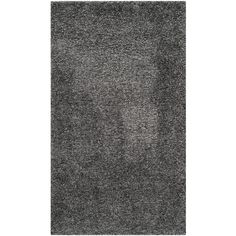 an area rug with dark gray carpeting