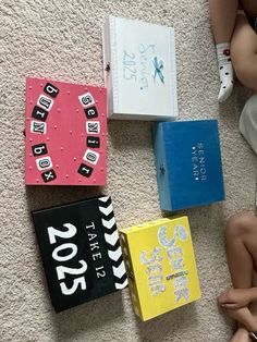 children are sitting on the floor with their books