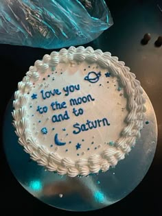 a birthday cake with the words i love you to the moon and back written on it