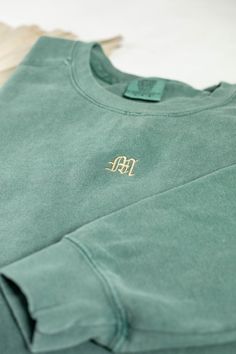 Stay cozy and stylish with the Comfort Colors or Gildan Single Letter Monogram Sweatshirt. This personalized sweater features custom initials in a stylish embroidery design. With its monogrammed fashion, this sweatshirt adds a personal touch to your wardrobe. It's a great option for those who appreciate customized and stylish clothing. All clothing and accessories from The Southern Thistle are handmade-to-order, just for you! ☺️ Our Gildan sweatshirt is made from a blend of 50% cotton and 50% polyester, ensuring comfort and durability. It features a classic fit with no center crease and a 1x1 athletic rib knit collar with spandex for added flexibility.  Experience ultimate comfort with our Comfort Colors shirt. Made from 9.5 oz. 80/20 ring spun cotton/polyester blend, this shirt offers a r Single Letter Monogram, Monogram Sweater, Mediterranean Wedding, Personalized Sweater, Monogram Sweatshirt, Gildan Sweatshirt, Comfort Colors Sweatshirt, Letter Monogram, Single Letter