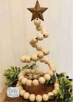 a christmas tree made out of wooden balls