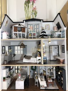 a doll house with furniture and decorations on the top floor is shown in this image