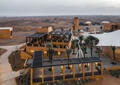 an aerial view of a desert resort at dusk