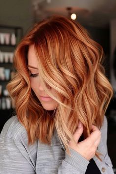 Blonde red hair is a timeless and chic choice! Check out our collection of beautiful red/blonde color ideas, including the copper blonde balayage style you see here. Click for 35+ more styles and follow us for more hair color inspo! Add Red To Blonde Hair, Blake Lively Hair Red, Lived In Auburn Balayage, Bright Blonde With Copper Lowlights, Red Hair Strawberry Blonde Highlights, Copper Lob With Fringe, Copper And Ash Blonde Hair, Auburn With Blonde Balayage, Shoulder Length Red And Blonde Hair