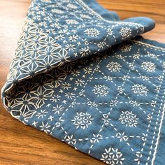 a close up of a cloth on a wooden table