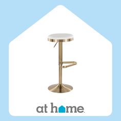 a white and gold stool with the words at home above it