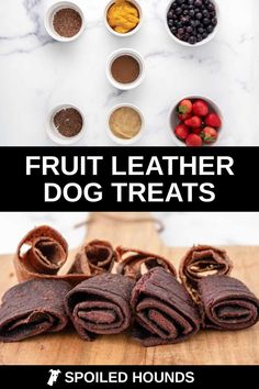 fruit leather dog treats on a wooden cutting board with bowls of berries, raspberries and