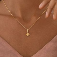 This delicate Serenecharm lotus charm is a beautiful and symbolic piece of jewelry. The lotus flower is a symbol of purity, enlightenment, and rebirth. It is a flower that grows in muddy waters, but rises above the mud to bloom in beauty. This charm is perfect for anyone who appreciates beauty and symbolism. It would make a great gift for a special someone or as a treat for yourself. The charm is also very versatile, and can be added to a necklace, bracelet, or keychain. Material: BrassFinishing: 18K Gold Plate over Brass / Rhodium PlatingLotus Size: 10mm x 9.4mmWeight: 1.9g Dainty Chain Necklace, Lotus Mandala, Lapis Lazuli Earrings, Muddy Waters, Brass Charms, Flower Charm, Crystal Pearls, Spiritual Awakening, Lotus Flower