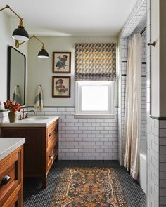 a bathroom with a rug on the floor