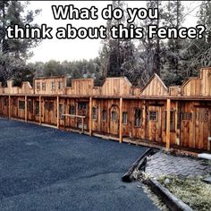 a row of wooden buildings with the words what do you think about this fence?