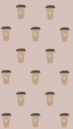 coffee cups are lined up against a pink background