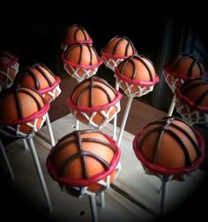 basketball cake pops with chocolate frosting on top