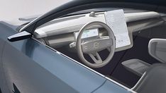 the interior of an electric car with its steering wheel and dashboard showing information on it