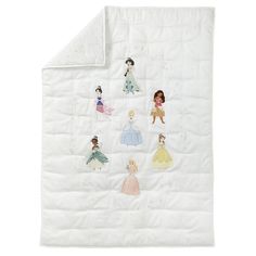 a white quilt with princess pictures on it