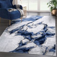 a blue and white area rug in a living room