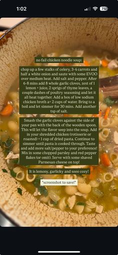 a bowl filled with pasta and vegetables on top of a wooden table next to a book