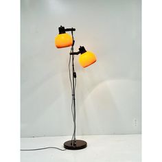 a lamp with two yellow lamps on it