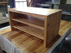 a wooden cabinet sitting on top of a table