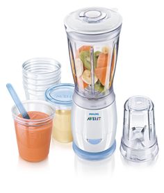 a blender filled with lots of different types of food next to cups and containers