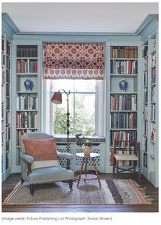 the instagram page for instagram com is displayed on an iphone screen, with two chairs and a table in front of bookshelves